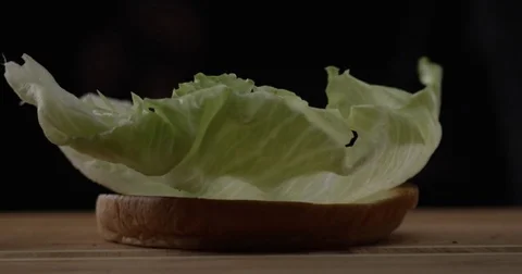 Bun. Loaf. Wad. Bread. Soft tack. Preparation of burger. Food. Kitchen. Cook. Vídeos de archivo 83354580