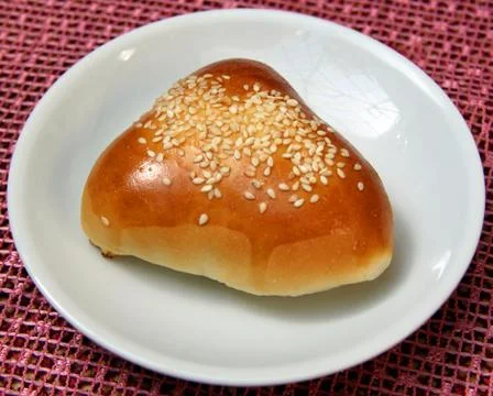 Bun lying on a the plate Stock Photos