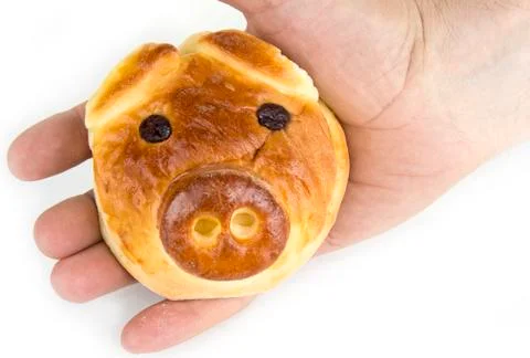 Bun with sweet stuffing in shape of pig head Stock Photos