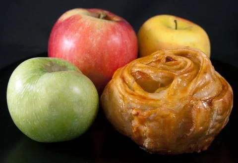Bun with three apples Stock Photos