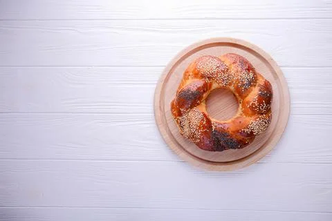 Bun on a white background with space for text. Russian national bread Kalach Stock Photos