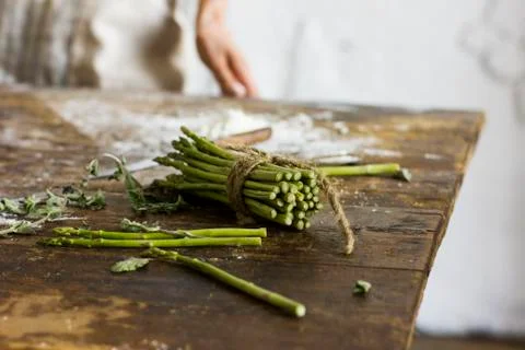 Bunch of asparagus on the kitchen table Stock Photos