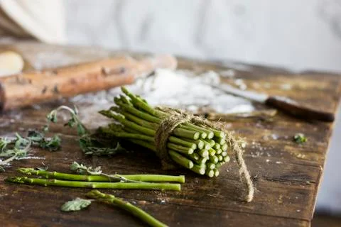 Bunch of asparagus on the kitchen table Stock Photos