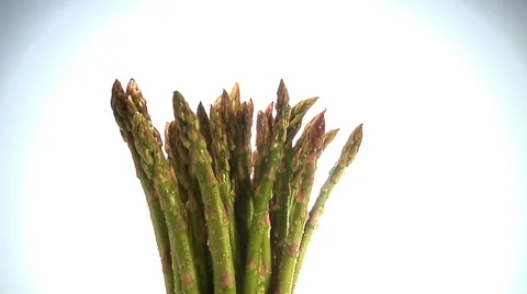 Bunch of asparagus spear tips rotate in frame Stock Footage 46371615