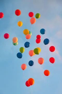 Bunch of balloons floating in sky Foto stock