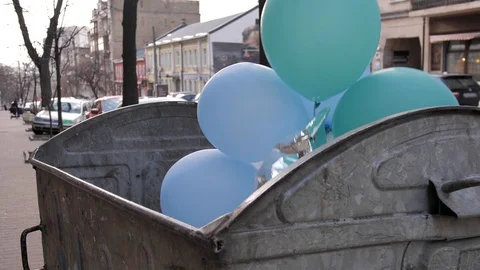 Bunch of balloons in garbage bin for non recycle products Stock Footage 128074747