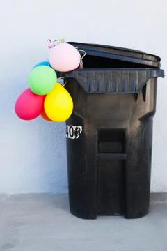 Bunch of balloons in garbage can 写真素材