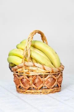 Bunch of bananas in basket Stock Photos