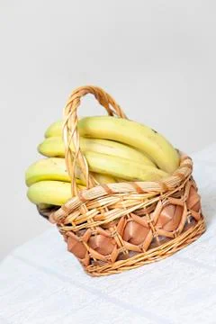 Bunch of bananas in basket Stock Photos