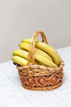 Bunch of bananas in basket Stock Photos