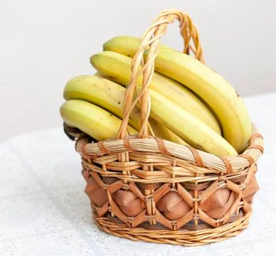 Bunch of bananas in basket Stock Photos