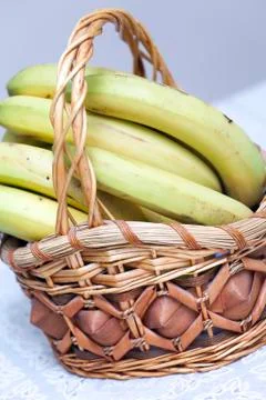 Bunch of bananas in basket Stock Photos