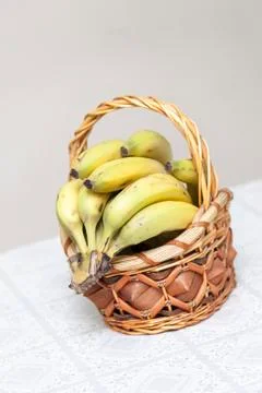 Bunch of bananas in basket Stock Photos