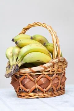 Bunch of bananas in basket Stock Photos