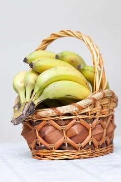Bunch of bananas in basket Stock Photos