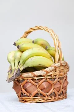 Bunch of bananas in basket Stock Photos