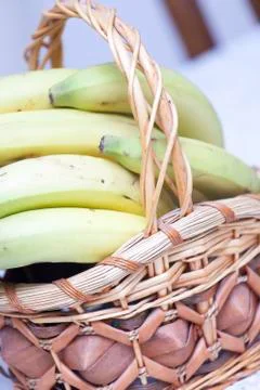 Bunch of bananas in basket Stock Photos