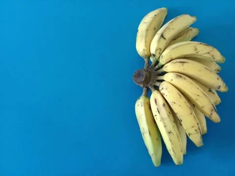 Bunch of bananas with blue background Stock Photos