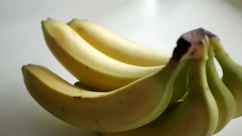 A bunch of bananas on a white background Video stock 153436420