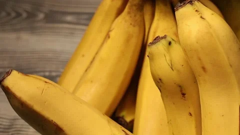 Bunch of bananas on wooden table Video stock 170774483
