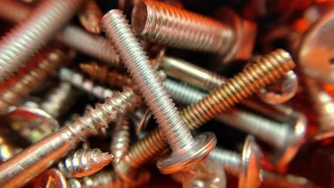 A bunch of bolts screws nuts of different sizes Stock Photos