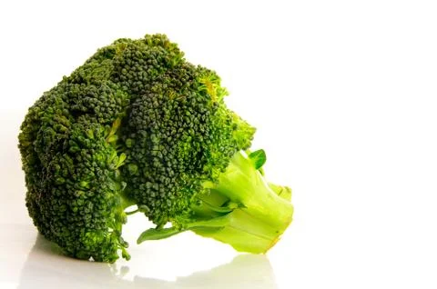 Bunch of broccoli closeup on white background Stock Photos