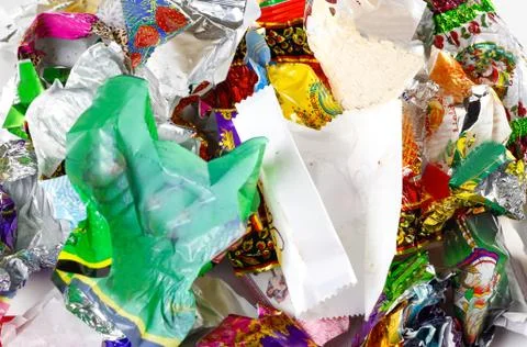 A bunch of candy wrappers on a white background. Closeup 스톡 사진