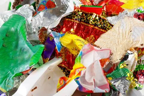 A bunch of candy wrappers on a white background. Closeup Foto stock