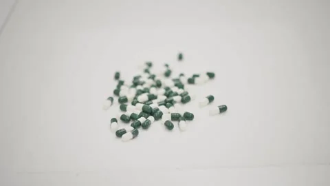 Bunch of capsules placed on white table in lab Stock Footage 269340597