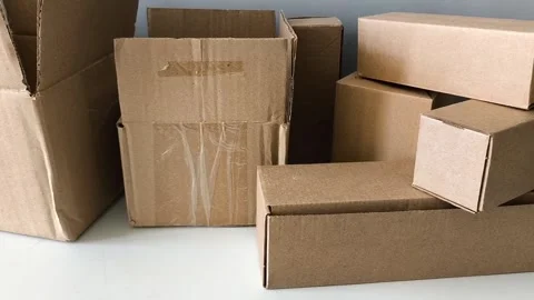 A bunch of cardboard boxes. Warehouse of goods, parcels. Logistics company Vídeos de archivo 330040078