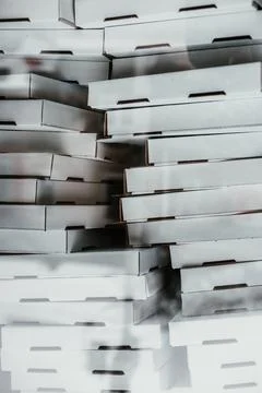 A bunch of cardboard pizza boxes Stock Photos
