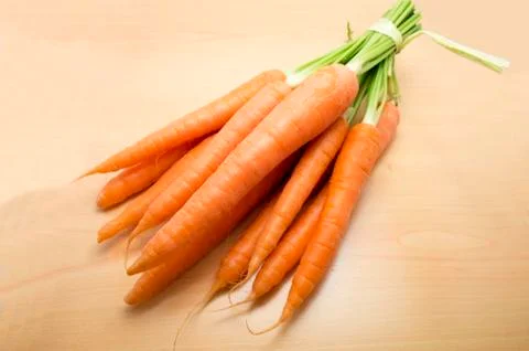 Bunch of carrots on a table Foto stock