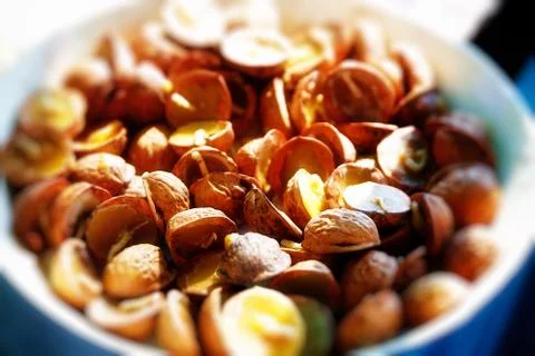 Bunch of charming tiny wax candles placed in wallnut shells Foto stock