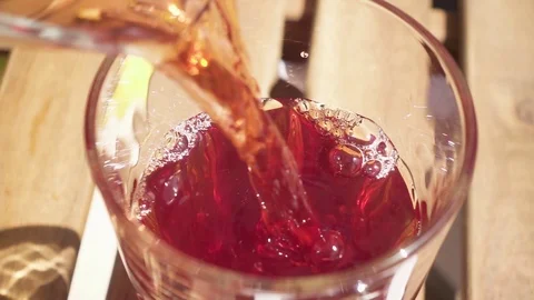 A bunch of cherries and cherry juice on a table Stock Footage 90651762