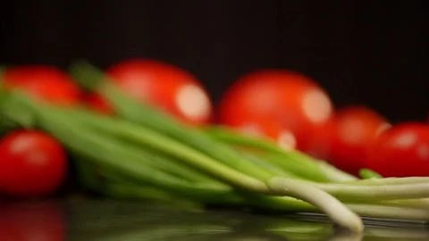 A bunch of cherry tomatoes are sitting on a table Stock Footage 268280399