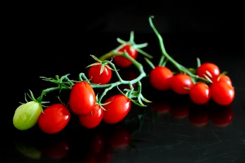 Bunch of cherry tomatoes Stock Photos