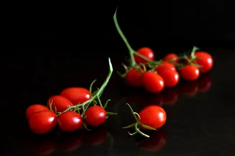 Bunch of cherry tomatoes Stock Photos