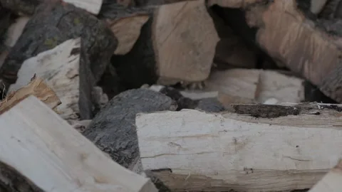 A bunch of chopped firewood panoramic close-up shot Video stock 178490472