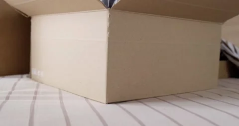 Bunch of clothes being packed in box, donation concept. Stock Footage 155073756