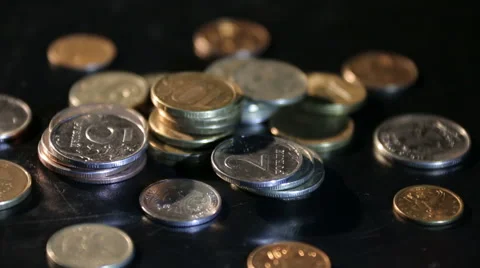A bunch of coins spinning on a stand. Stock Footage 61404553
