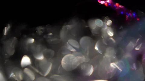 A bunch of colored bokeh lights moving from right to left. Stock Footage 315314724