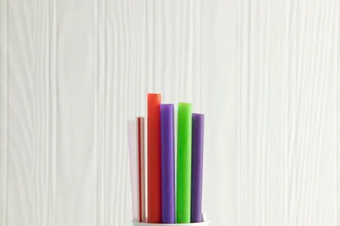 Bunch of colored plastic straws isolated on white background close up. Ban si Stock Photos