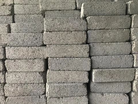 Bunch of concrete sand bricks. Selective focus. Stock Photos