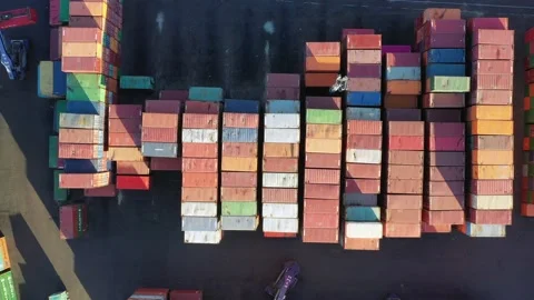 A bunch of containers of various colors ready to be loaded on board a cargo 動画素材 220939035