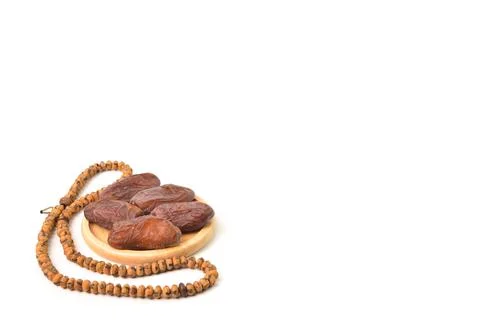 Bunch of Dates and Islamic prayer beads isolated on a white background with c 写真素材