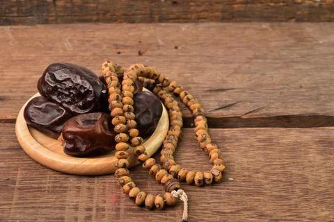Bunch of dates and islamic prayer beads with copy space. Ramadan kareem festi 写真素材