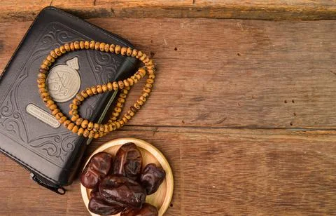 Bunch of dates, Islamic prayer beads and holy quran with copy space. Ramadan 写真素材