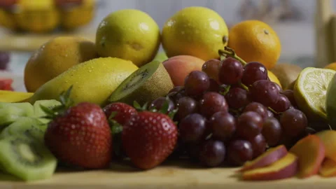 Bunch of delicious fruit on kitchen counter - closeup, tracking shot Stock Footage 341254479