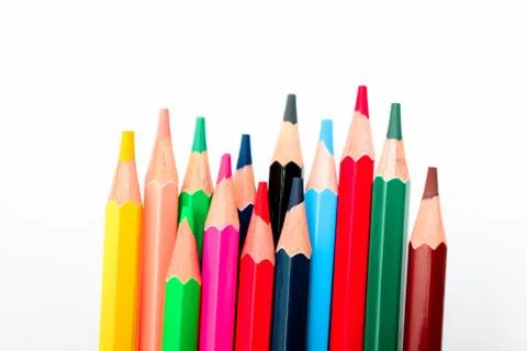 Bunch of different colored pencil crayons isolated on a white background Stock Photos