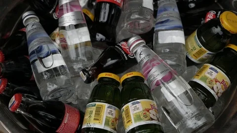 A bunch of different drinks in glass bottles Stock Footage 123110945
